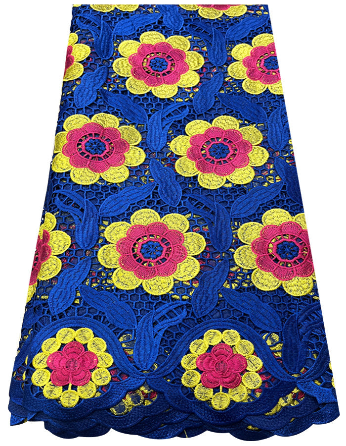A piece of African lace fabric featuring royal blue, pink, and yellow floral patterns.