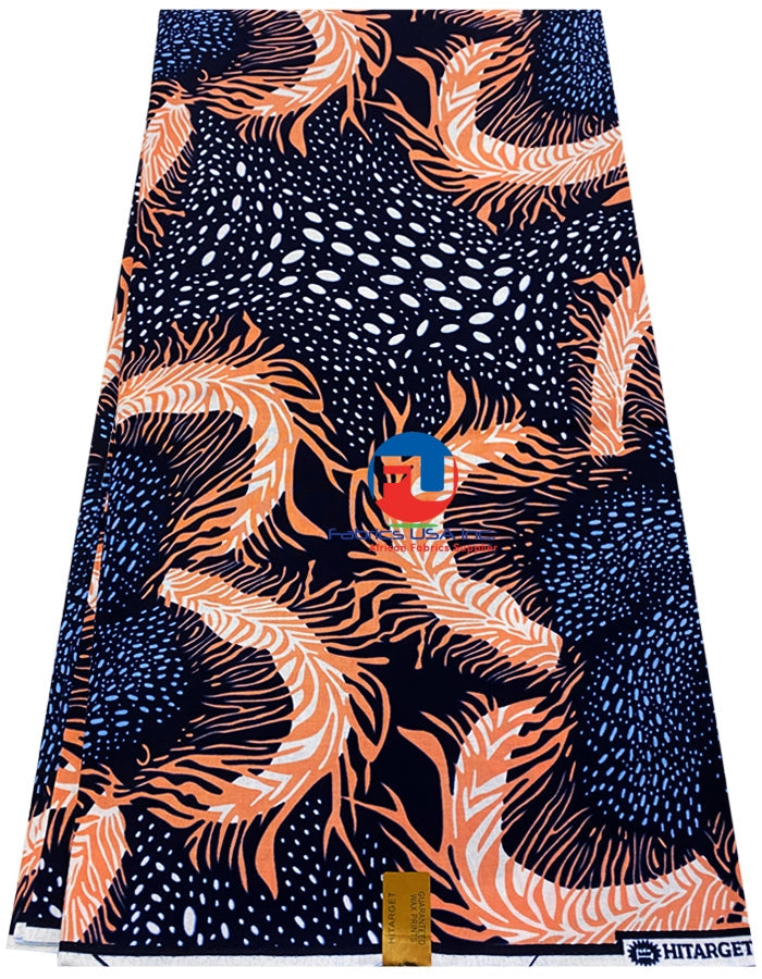 A swatch of African print fabric featuring a geometric pattern with peach, white, denim blue, and black colors.