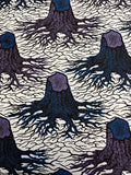 A textile design featuring abstract patterns with purple, royal blue, black, and white colors, resembling yam plants.