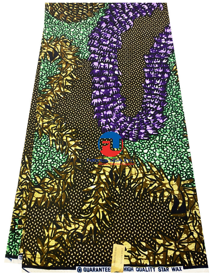 A fabric featuring an ankara print in purple, green, black, and white colors with a variety of geometric and floral patterns.