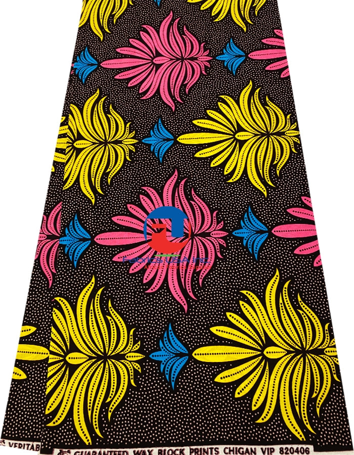 Ankara print fabric featuring geometric and floral patterns in pink, yellow, blue, and burgundy colors on a black background.