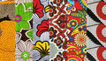 A collage of six different pieces of assorted African print fabrics showcasing vibrant patterns and colors.