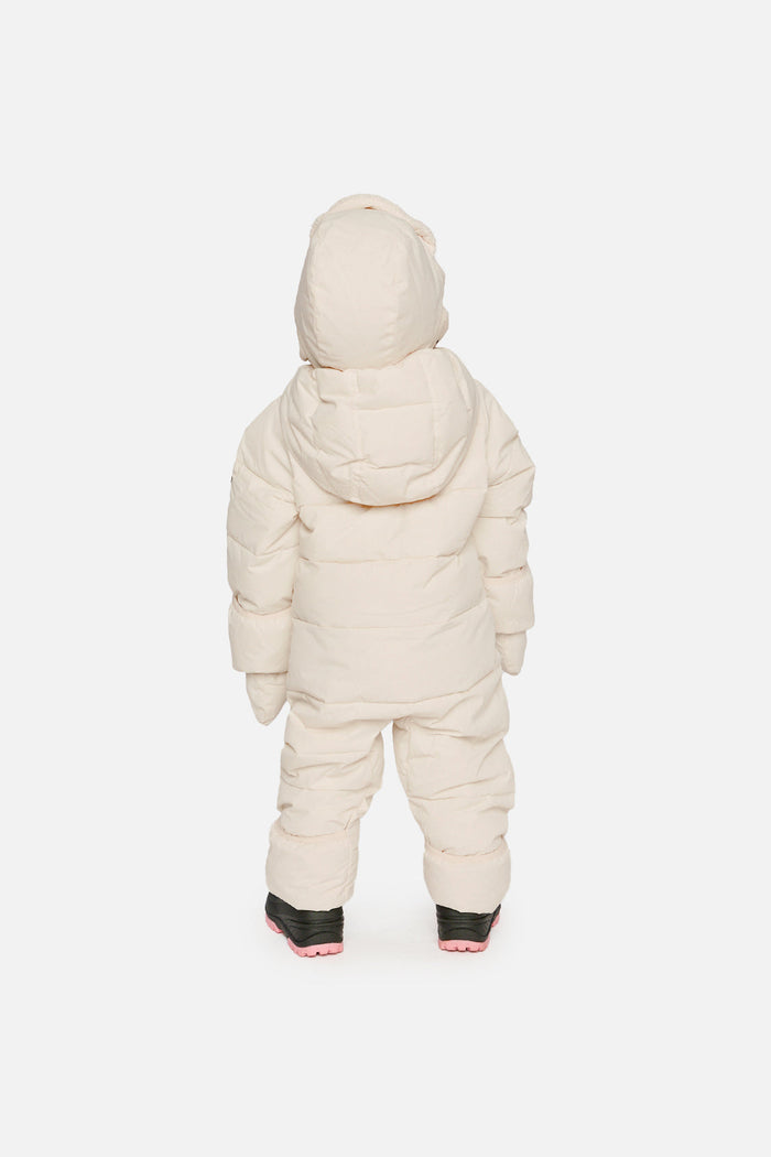 Back view of a baby in the off-white Baby Cloud snowsuit