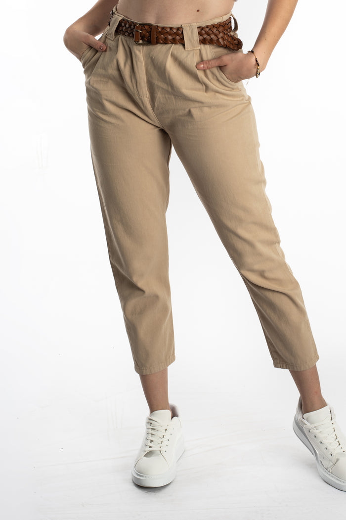 Camryn high-waisted beige wide-leg trousers with a brown braided belt and cropped ankle fit, paired with white sneakers.