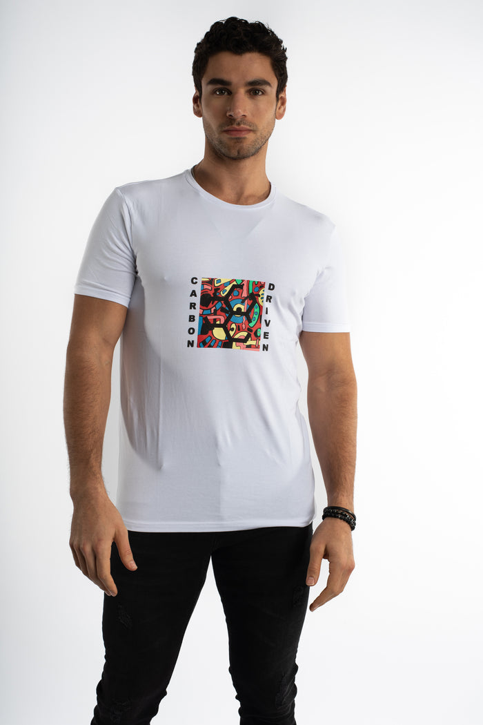 Model in Carbon Driven white graphic tee with a colorful urban streetwear design and black jeans.