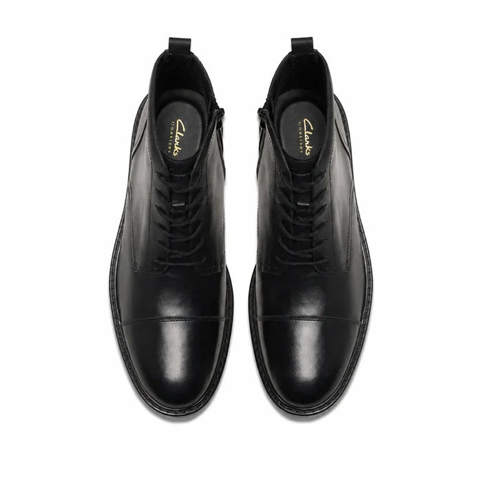 Pair of men's black leather lace-up ankle boots, top view
