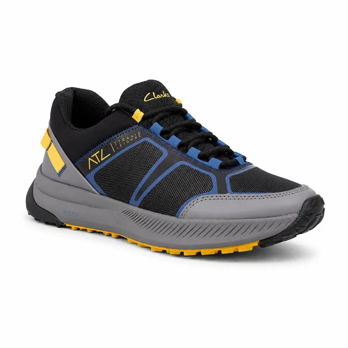 Black men’s trail sneaker with blue panels, gray sole, and yellow accents