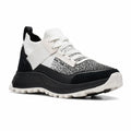 Women’s lace-up knit sneaker in white and black with a chunky treaded sole