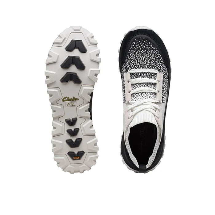Pair of women’s lace-up knit sneakers, white and black uppers with rugged rubber outsoles
