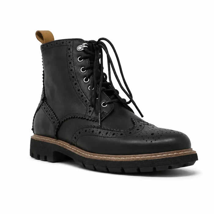 Black leather lace-up brogue boots with wingtip perforations and chunky sole