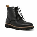 Black leather lace-up brogue boots with wingtip perforations and chunky sole