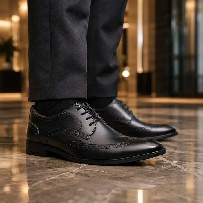 Men's black leather lace-up dress shoes with brogue wingtip and textured trim