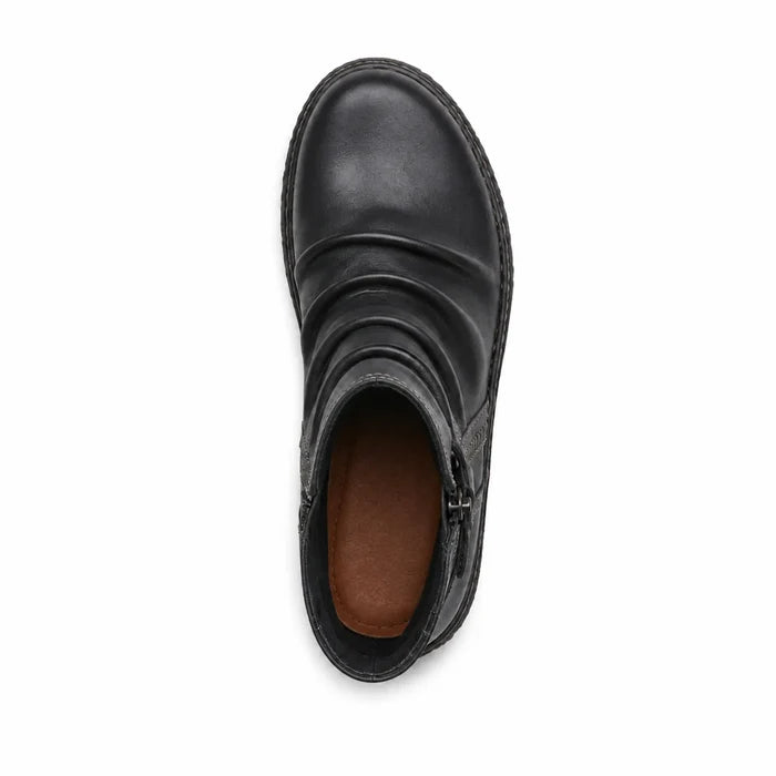 Black leather ankle boot showing lining interior and rubber sole tread