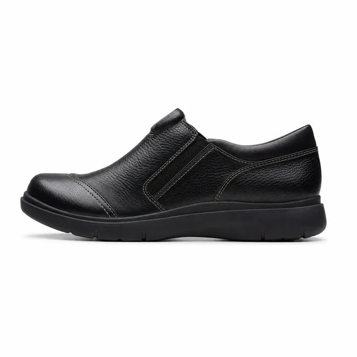Women's black leather casual slip-on shoe with side zip and textured upper