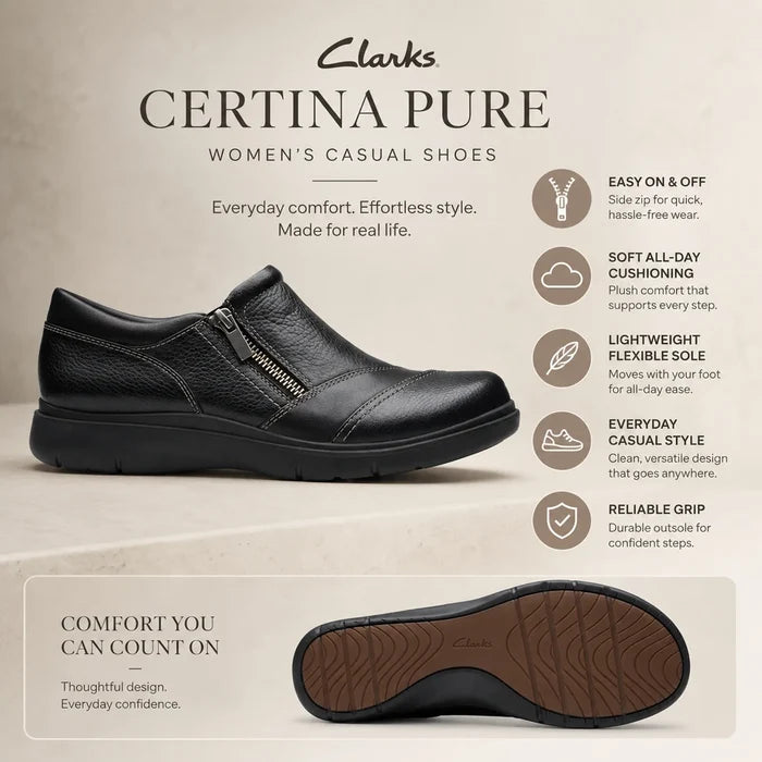 Women's black leather casual shoe with side zip and visible tread outsole