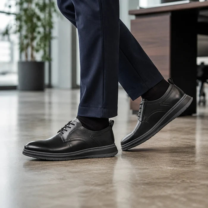 Men's black leather lace-up business shoes with side profile and tread sole
