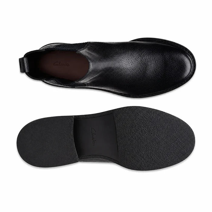 Women's black leather Chelsea boots, interior view and outsole bottom