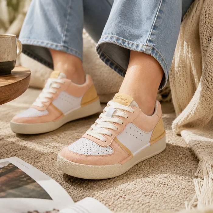 Women’s sneakers in pale peach and white with lace-up and cushioned sole