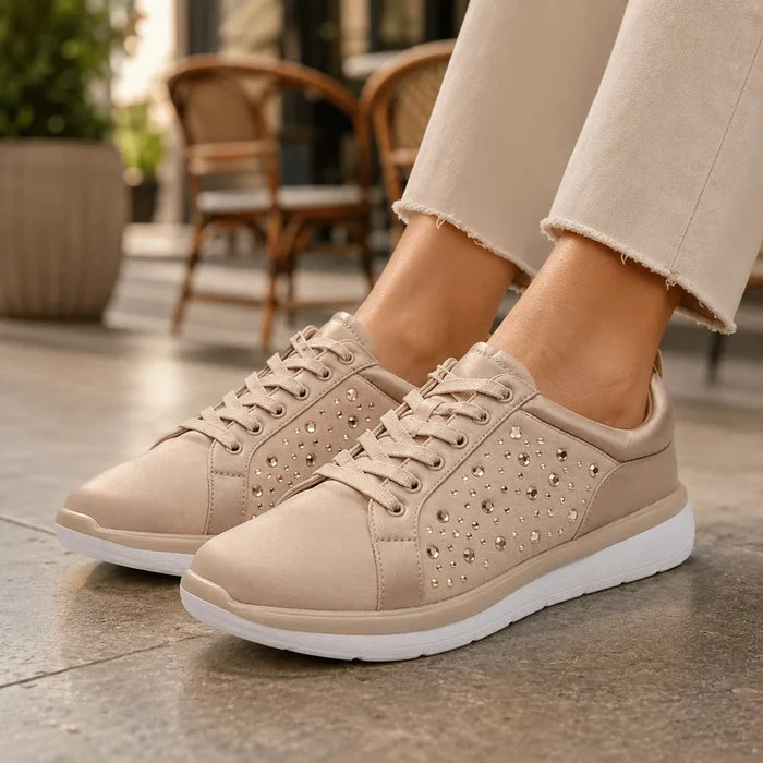Taupe metallic lace-up sneakers with studded panel design and white sole.