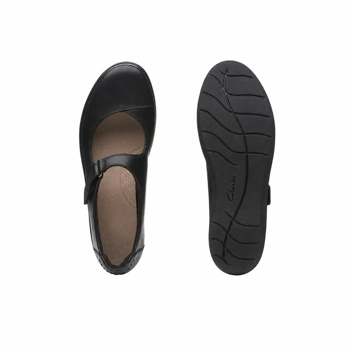 Black leather loafer pair with adjustable strap, showing side and tread outsole