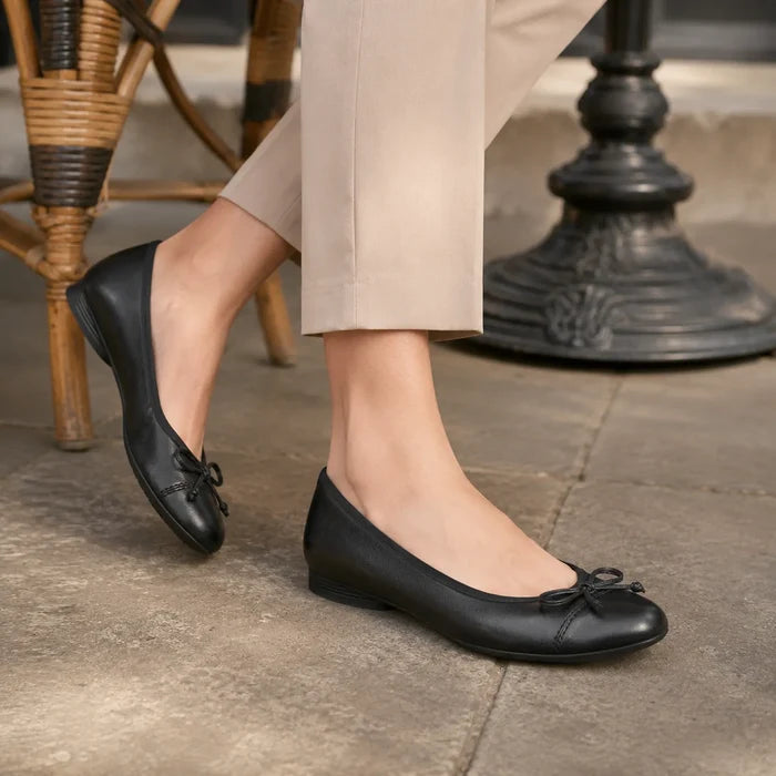Black leather loafer flats with bow detail and smooth toe, low wedge heel