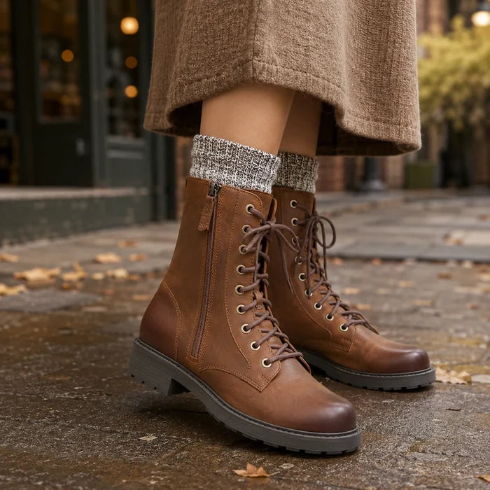 Brown leather lace-up ankle boots with side zipper and rugged tread sole