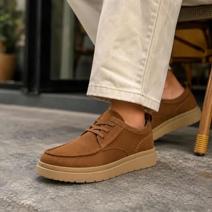 Dark brown suede moc toe loafers with lace-up front and tan rubber sole
