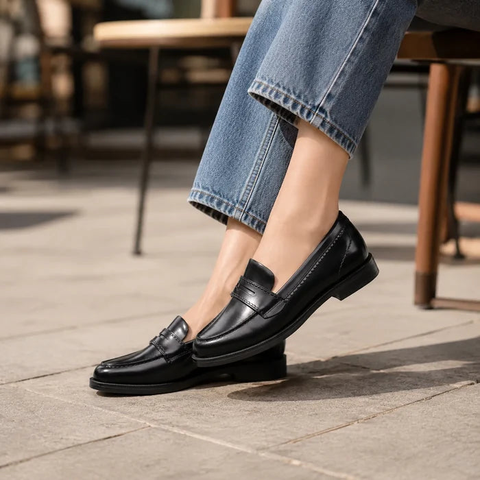 Black leather loafers with penny vamp strap, low stacked heel with side stitching