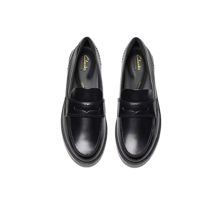 Pair of black leather loafers with penny-style strap and rounded toe