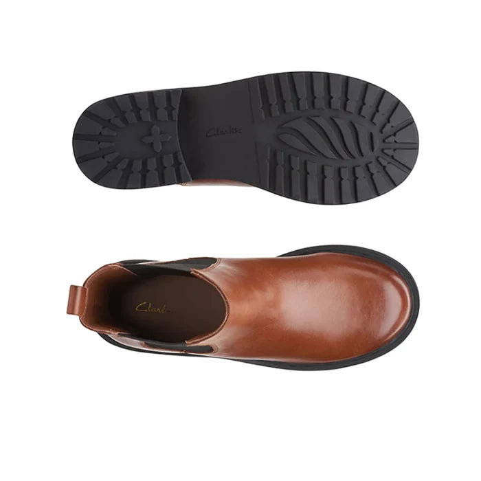Brown Chelsea boot side view with elastic gore and tread sole