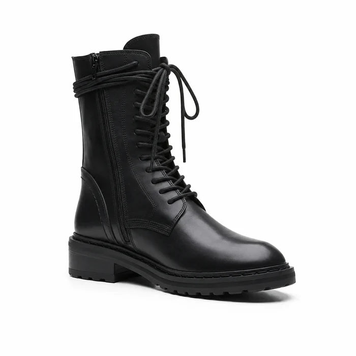 Lace-up leather ankle boots in black with thick rubber sole and padded collar.