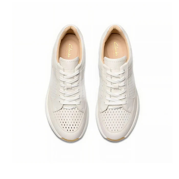 Beige leather lace-up sneakers with perforated toe and side panels, gum sole