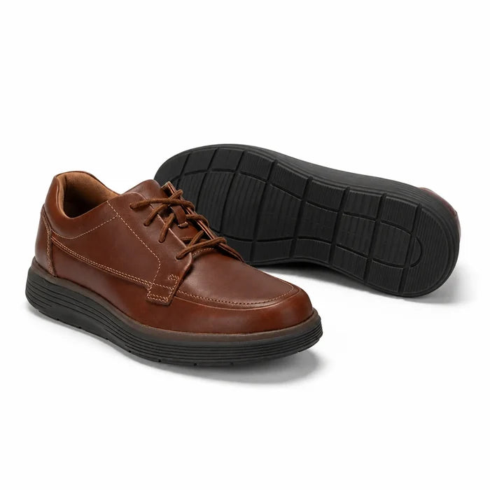 Brown leather lace-up business shoes with black rubber outsole tread