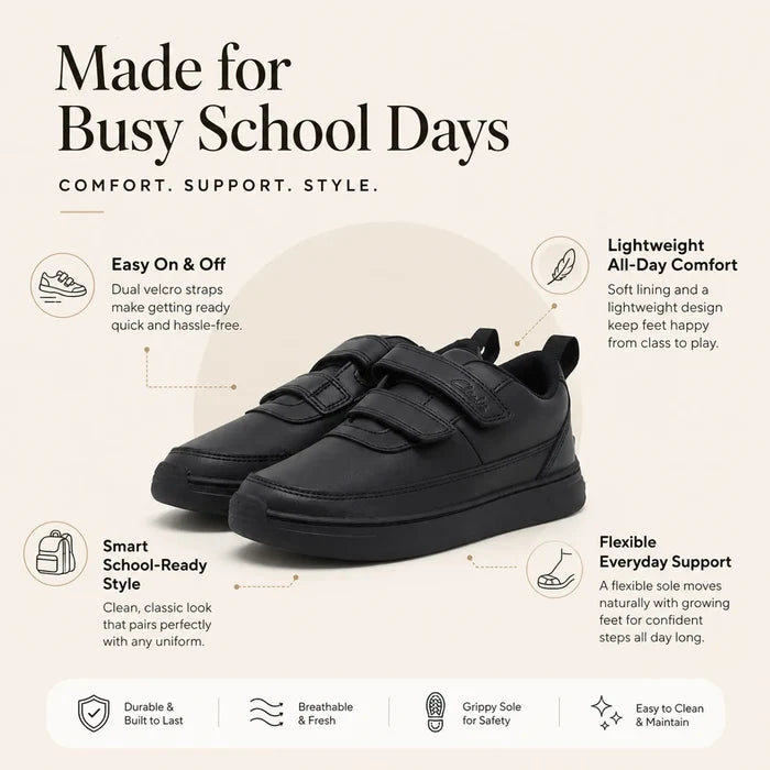 Black kids sneakers with dual Velcro straps and flexible rubber sole, pull tab