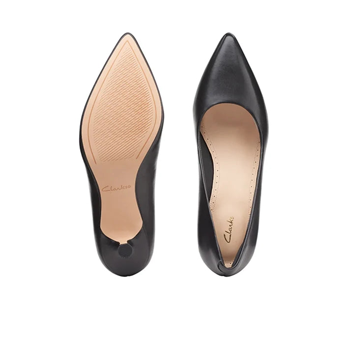 Pair of women's black heeled court shoes with pointed toe and smooth leather look