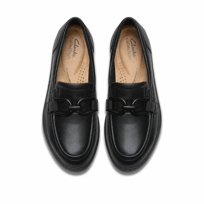 Black leather loafer pair with strap detail and tan footbed