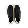 Top view of Carbon Jeans black low-top sneakers with white heel tabs and matching black laces on a white background.