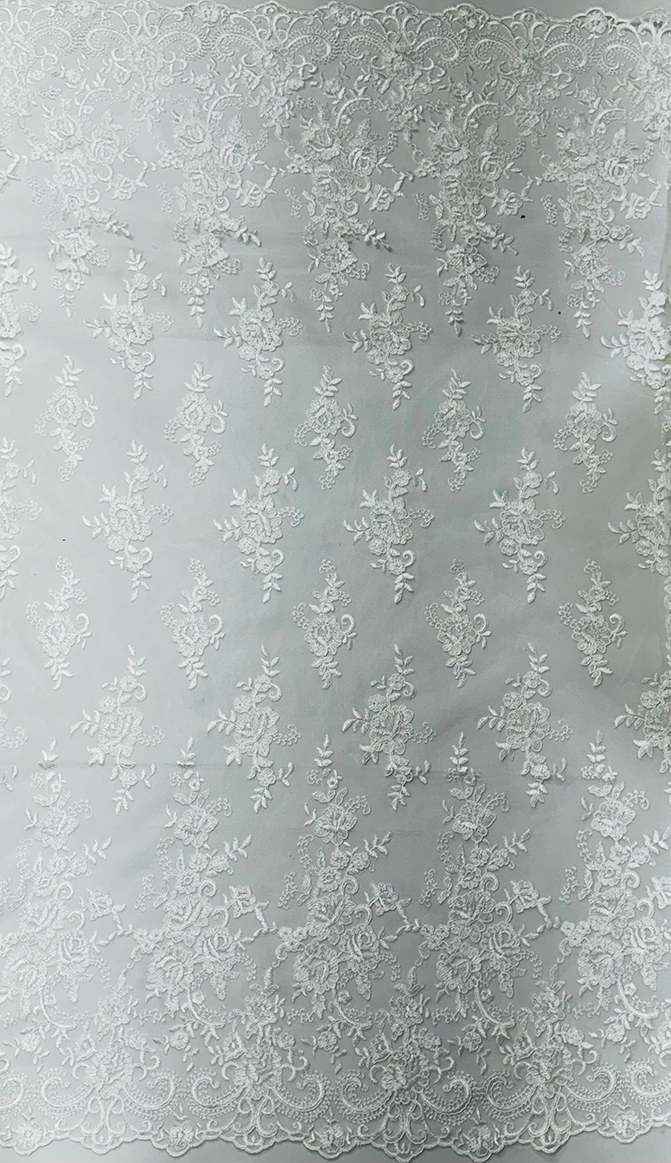 A piece of corded floral lace fabric in off-white color with metallic thread detailing.