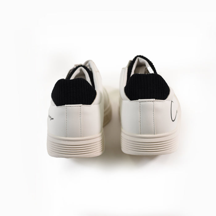 Rear view of white Cursive Low-Top Streetwear Sneakers with black textured heel tabs and urban rubber soles.