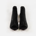 Pair of Carbon black rhinestone stiletto evening heels with sparkly peep-toe mesh cutout design and back zipper.