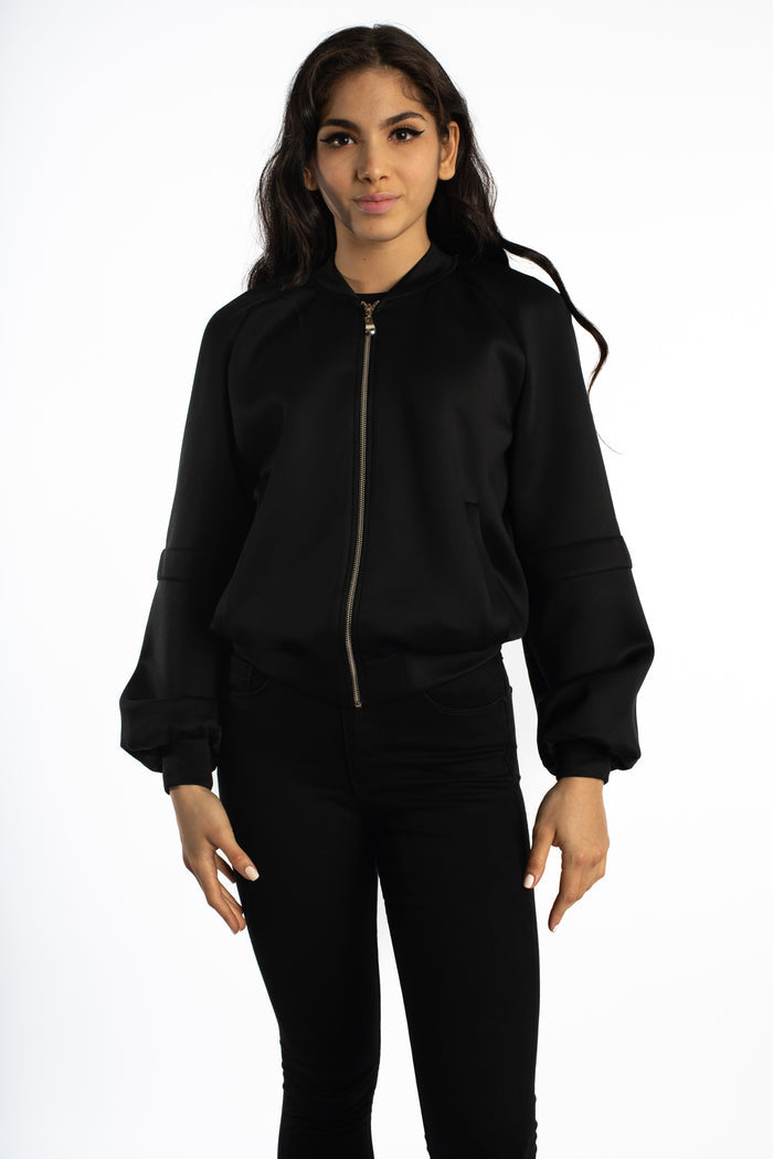 Model wearing the Ellis Bomber Jacket in Carbon black, a full-zip streetwear essential with an oversized modern silhouette.
