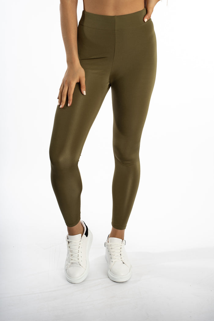 Emory high-waisted olive green leggings by Carbon Jeans, featuring squat-proof compression and a subtle sheen.