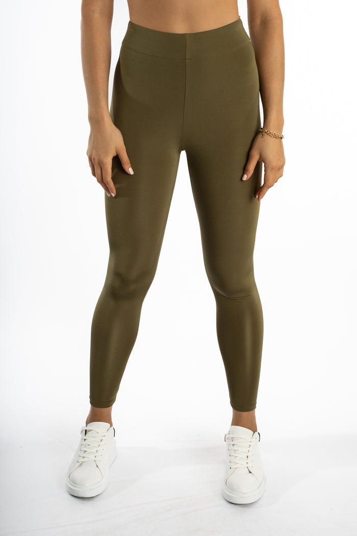 Emory olive green high-waisted leggings with a sculpting compression fit and subtle sheen by Carbon Jeans.