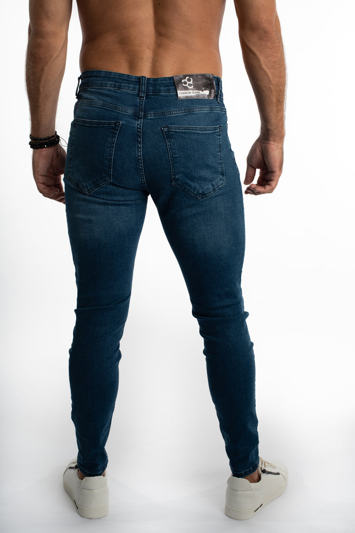 Back view of Finn Slim Fit Blue Denim Jeans for men by Carbon, featuring classic pockets and a modern streetwear silhouette.