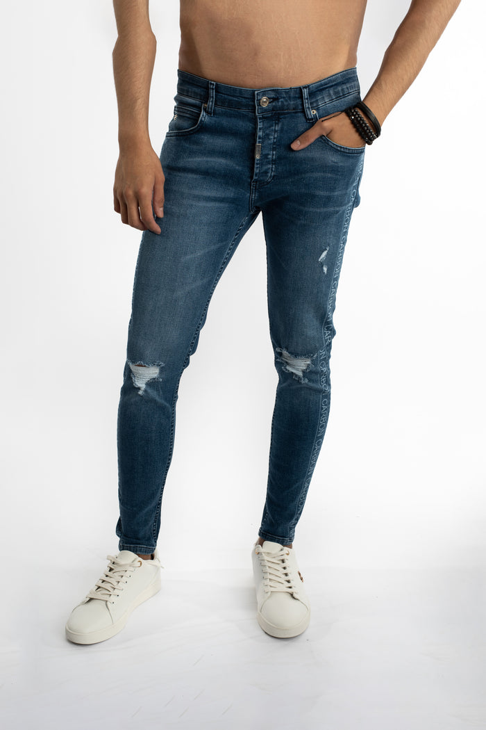 Finnley slim fit blue denim jeans for men with distressed knees and Carbon logo side tape detail.