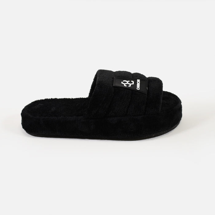 Carbon black Cloud-Soft Furry Slippers with plush faux fur and rubber logo patch. Cozy slide-on house shoes.