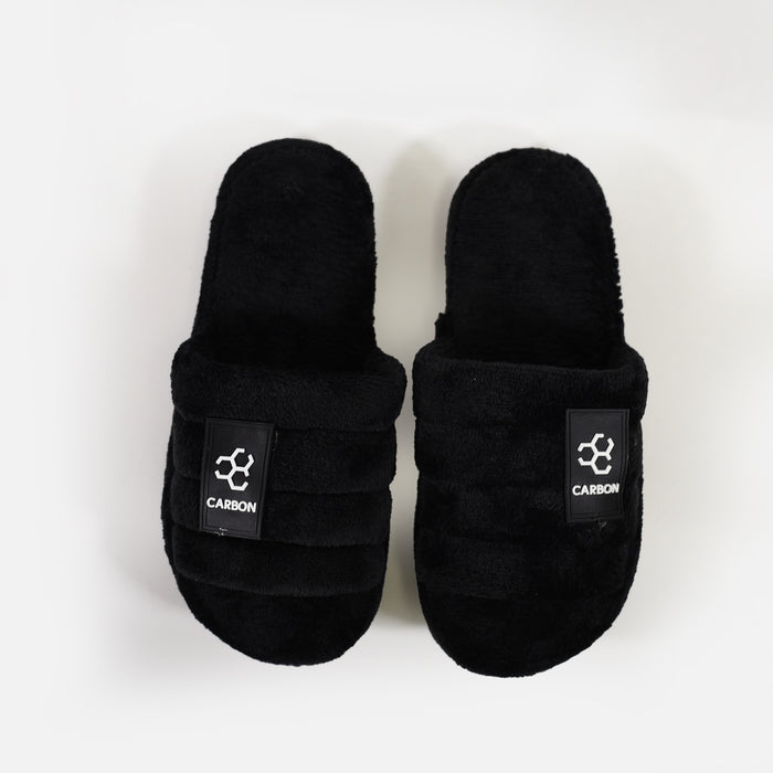 Carbon black cloud-soft furry slippers for women, featuring plush faux fur and brand logo on a white background.