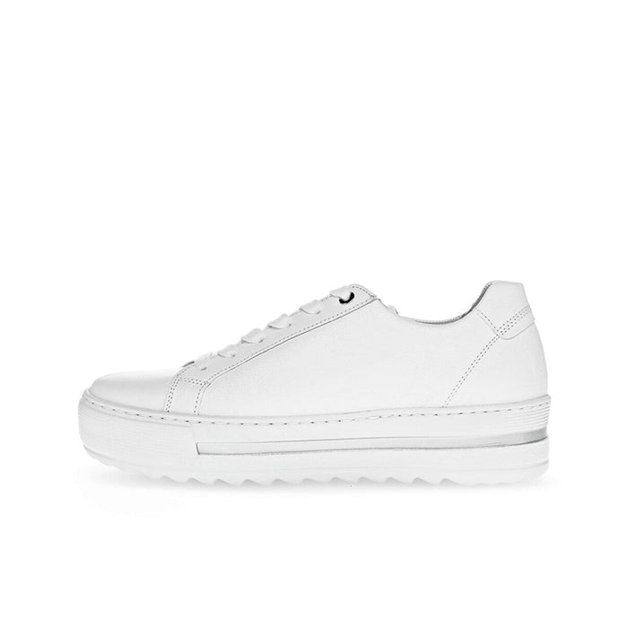 White leather low-top trainers, side view with lace-up and thick sole