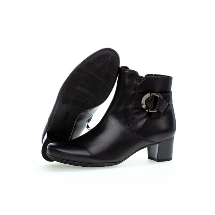 Women’s black leather ankle boots with buckle strap and stacked block heel