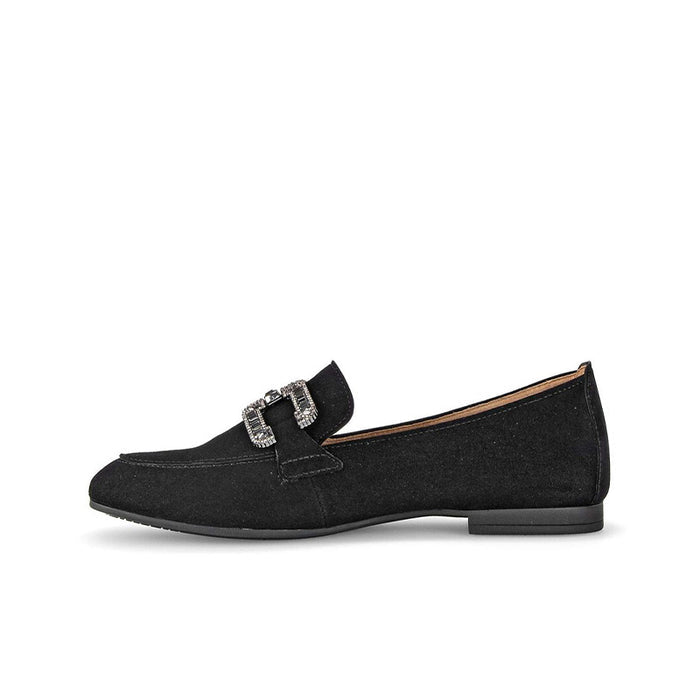Black leather loafer, side view, with square metal buckle and moc stitching